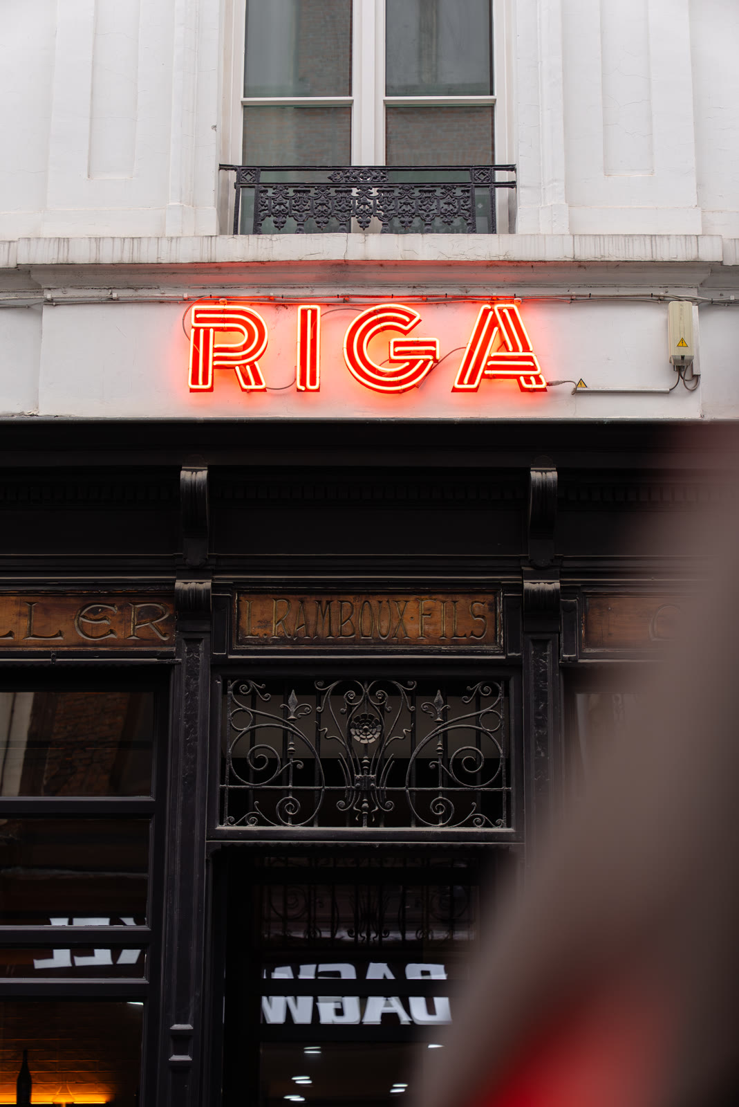 The Hotel Riga facade and red neon sign in Antwerp