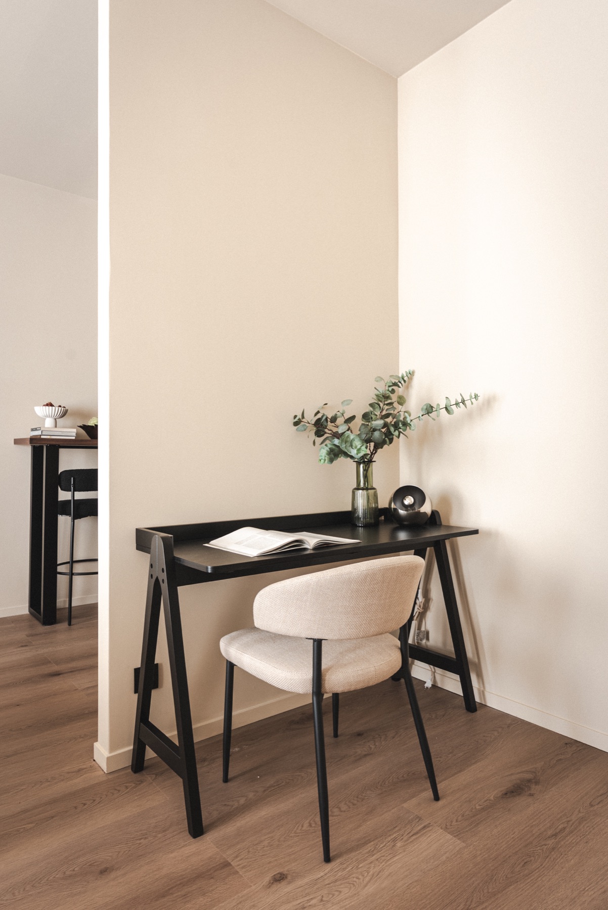 A calm desk and chair composition inside a RAIBU studio